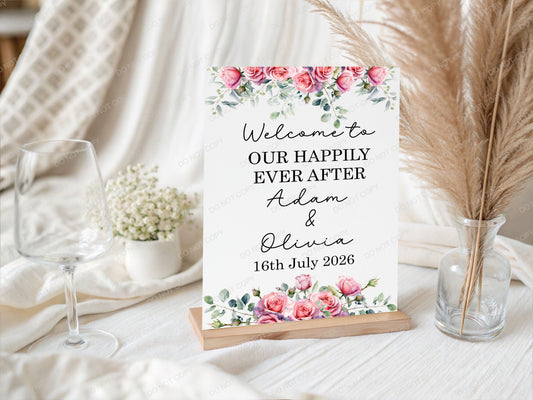 Decorative sign with floral design and wedding message on a table 