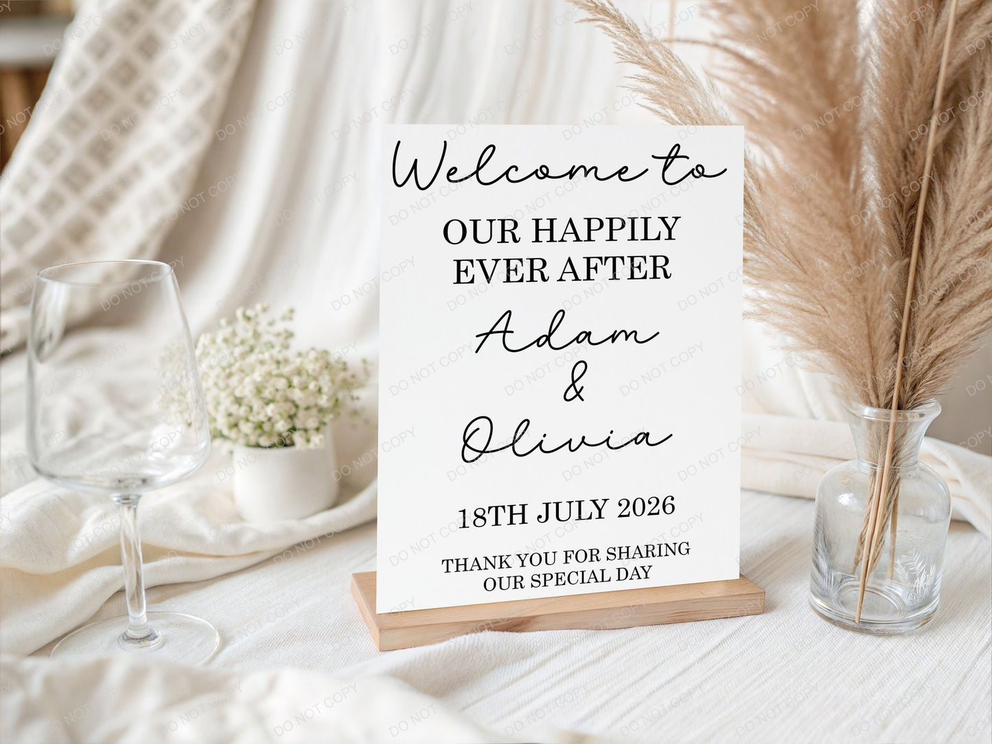Wedding welcome sign with personalized names and date on a decorative table setting.
